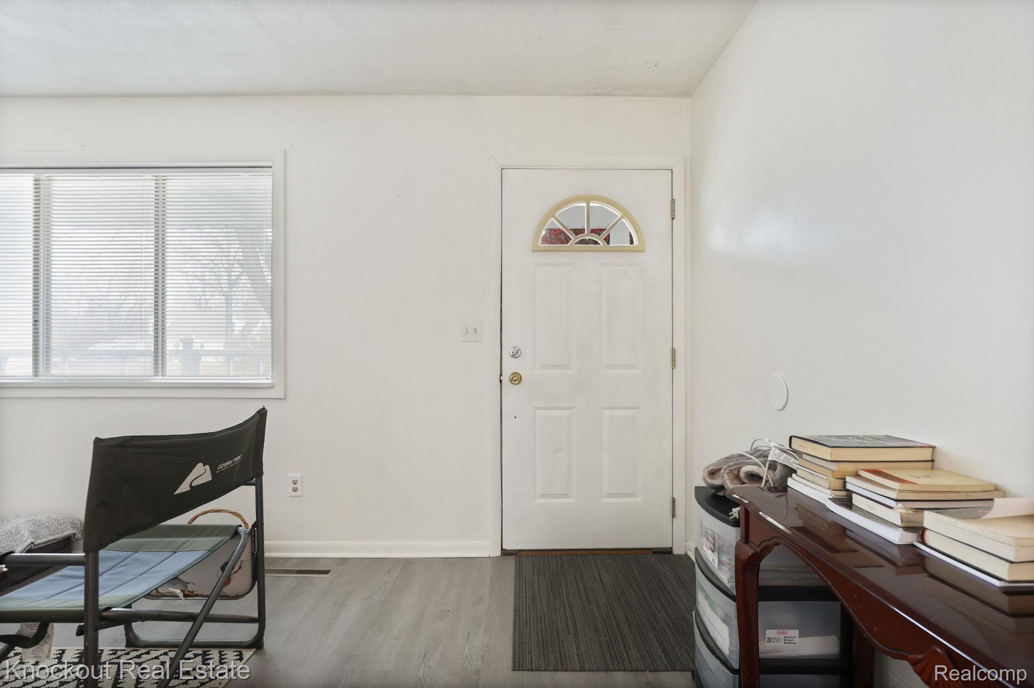 10456 North Nichols Road Montrose, MI 48457 - Photo 7 of 39 Entryway featuring wood finished floors and baseboards
