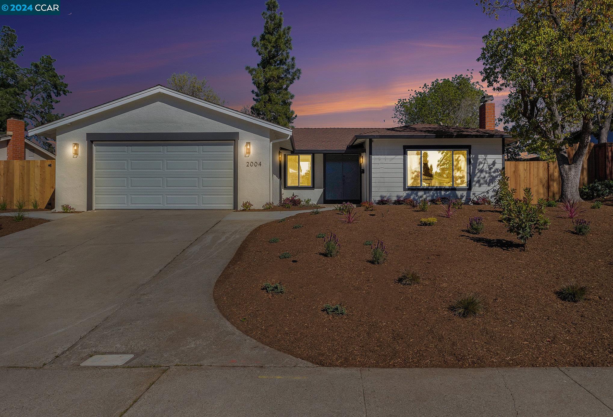 2004 Elderwood Drive Martinez, CA 94553 - Photo 1 of 1 a view of a house with large space and a car parked in front of it