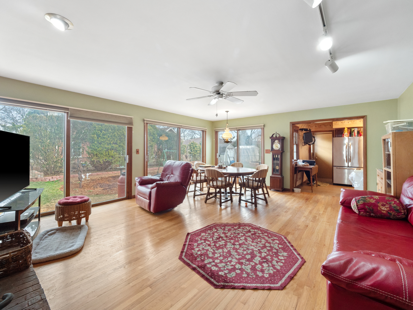 224 East Lahon Street Park Ridge, IL 60068 - Photo 11 of 25 a living room with furniture a flat screen tv and a large window