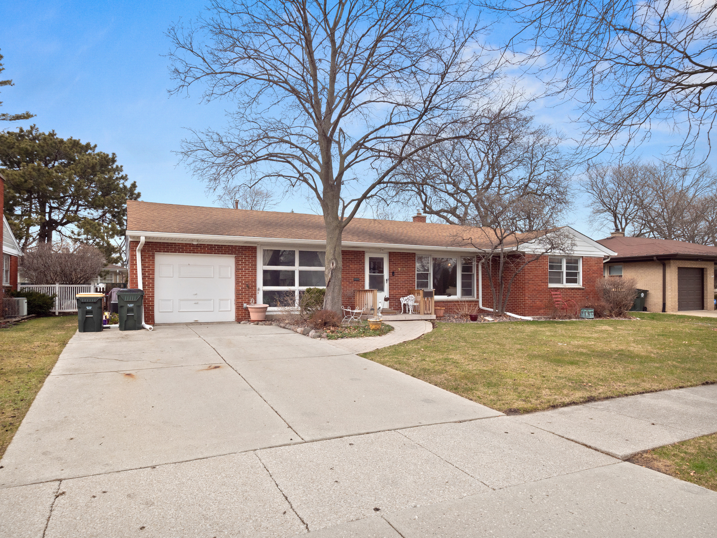 224 East Lahon Street Park Ridge, IL 60068 - Photo 3 of 25 a front view of a house with yard porch and outdoor seating