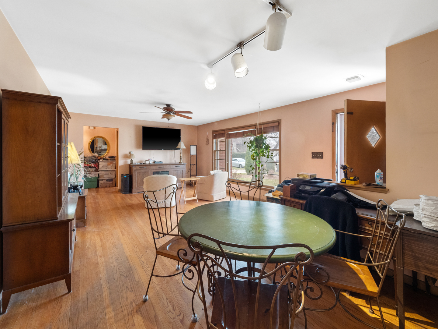 224 East Lahon Street Park Ridge, IL 60068 - Photo 5 of 25 a living room with a table chairs and a dining table