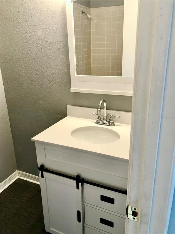 1037 South Hiawassee Road, Unit 2835 Orlando, FL 32835 - Photo 12 of 18 a bathroom with a sink and a mirror