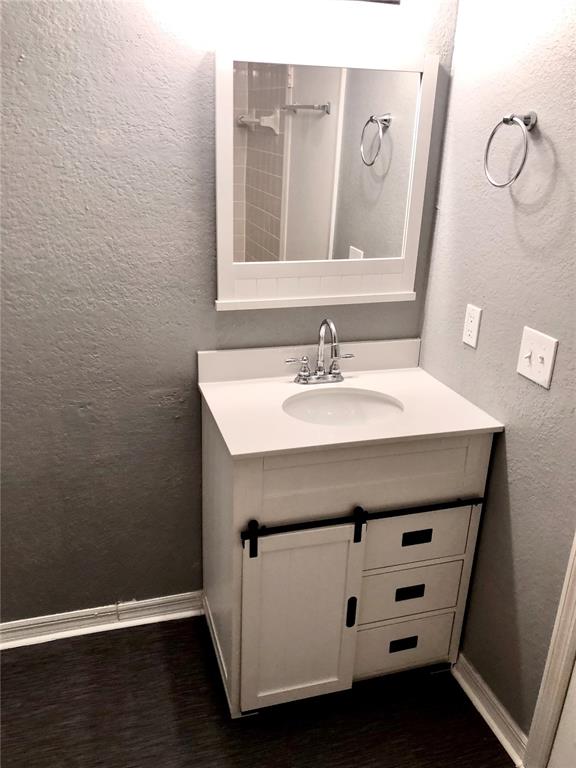 1037 South Hiawassee Road, Unit 2835 Orlando, FL 32835 - Photo 14 of 18 a bathroom with a sink a vanity and a mirror