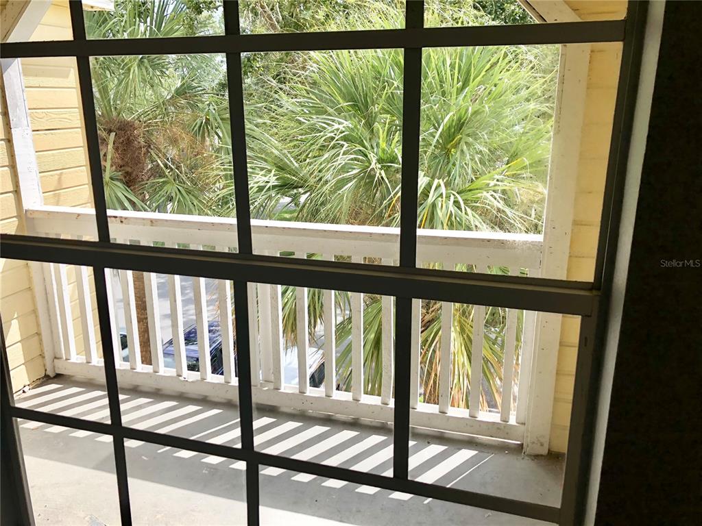 1037 South Hiawassee Road, Unit 2835 Orlando, FL 32835 - Photo 4 of 18 a view of trees and from the window
