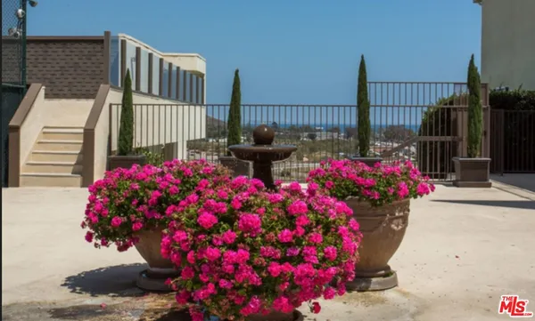 a view of a balcony with flower pot