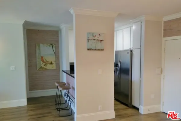 a kitchen with stainless steel appliances granite countertop a stove and a refrigerator