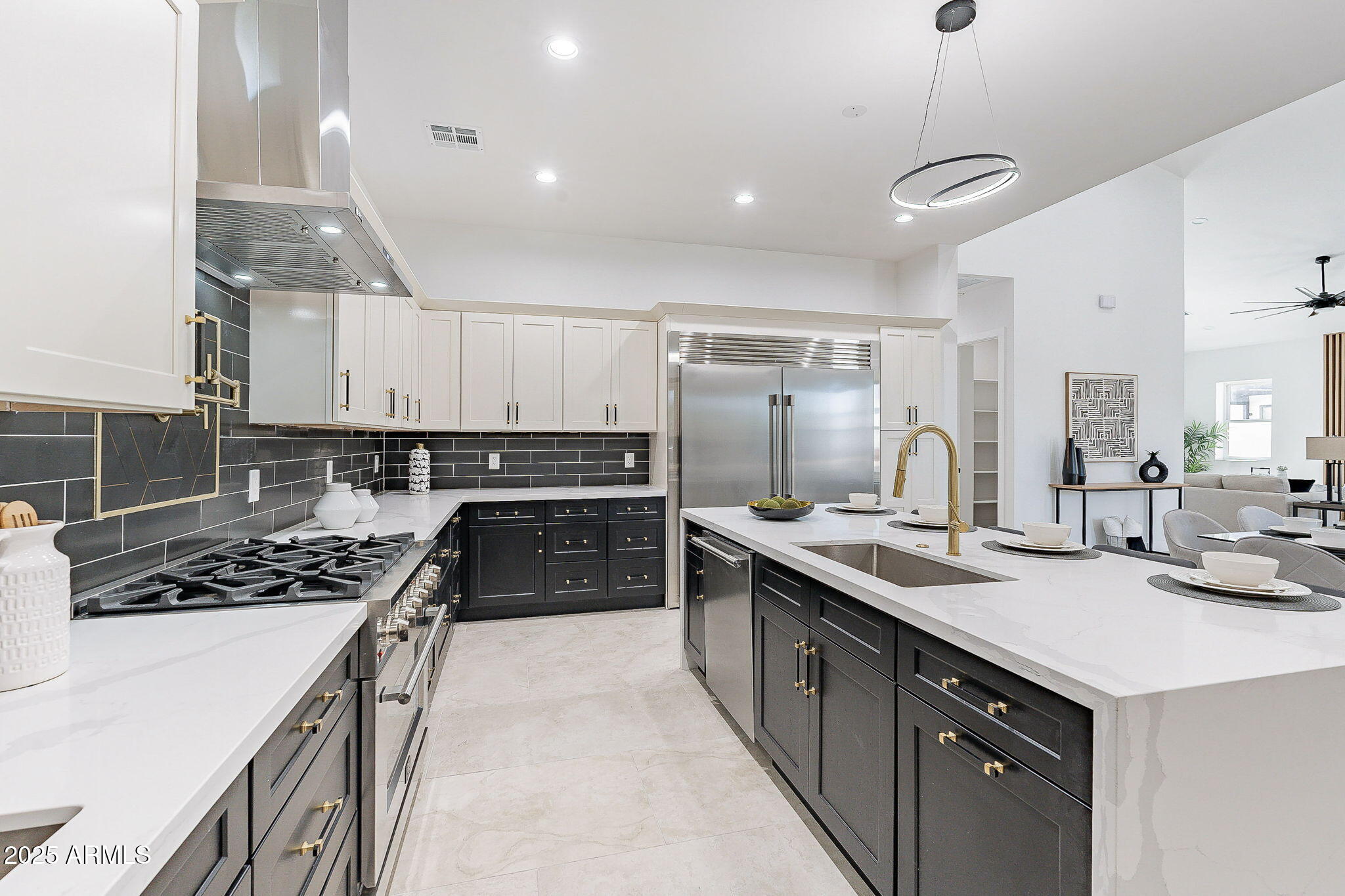 a kitchen with a sink stainless steel appliances and cabinets