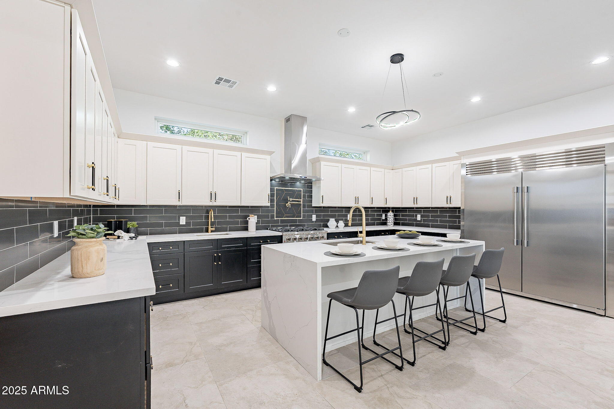 707 East Ocotillo Road Phoenix, AZ 85014 - Photo 21 of 59 a kitchen with a sink a counter top space stainless steel appliances and cabinets