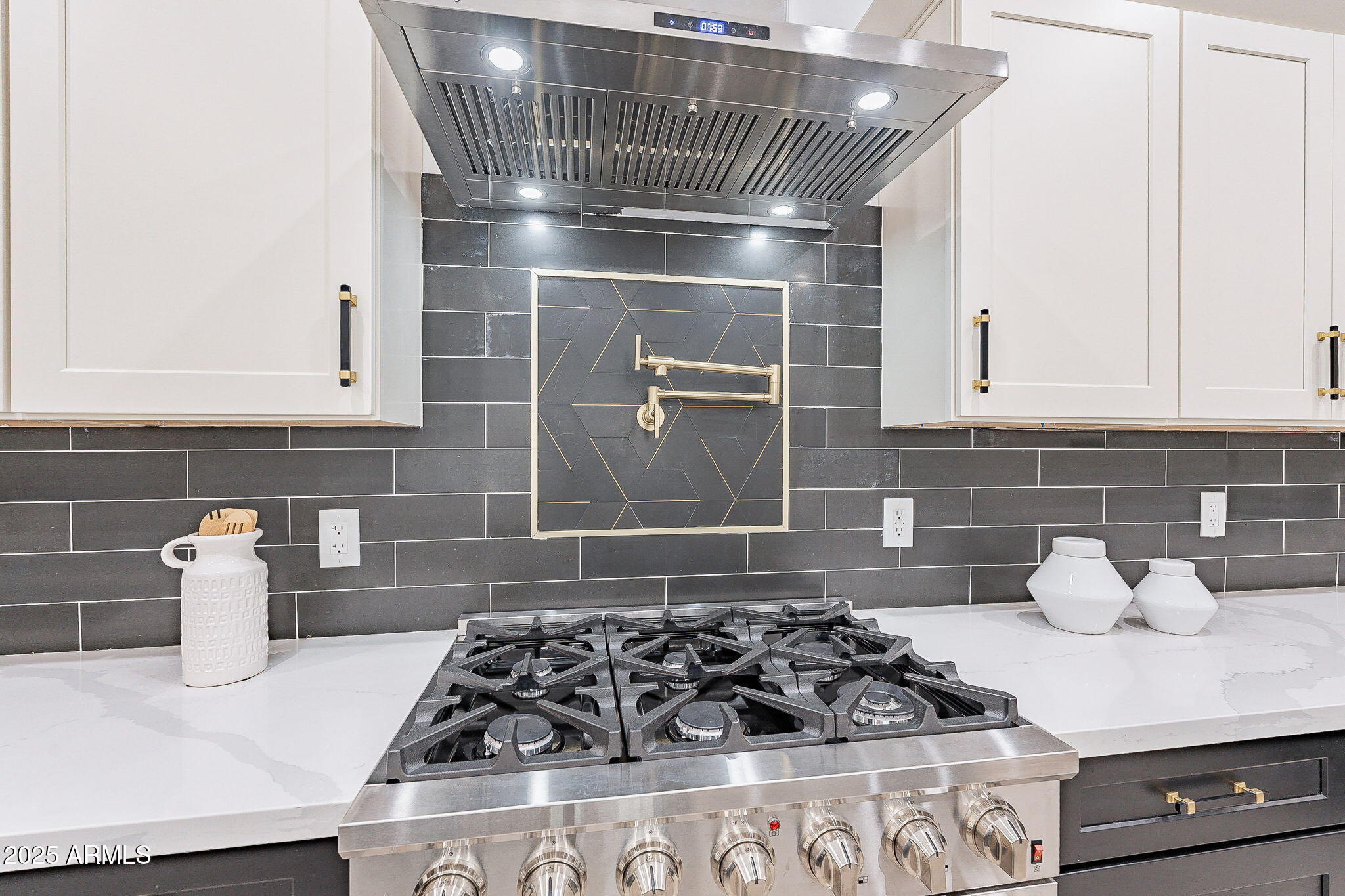 707 East Ocotillo Road Phoenix, AZ 85014 - Photo 25 of 59 a kitchen with a stove a sink and cabinets