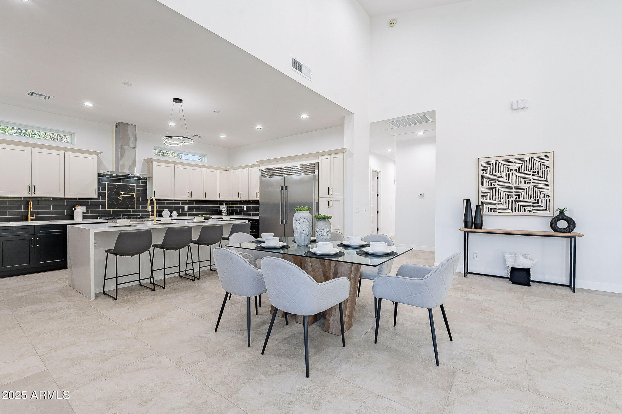 707 East Ocotillo Road Phoenix, AZ 85014 - Photo 2 of 59 a view of kitchen with stainless steel appliances kitchen island a table and chairs in it
