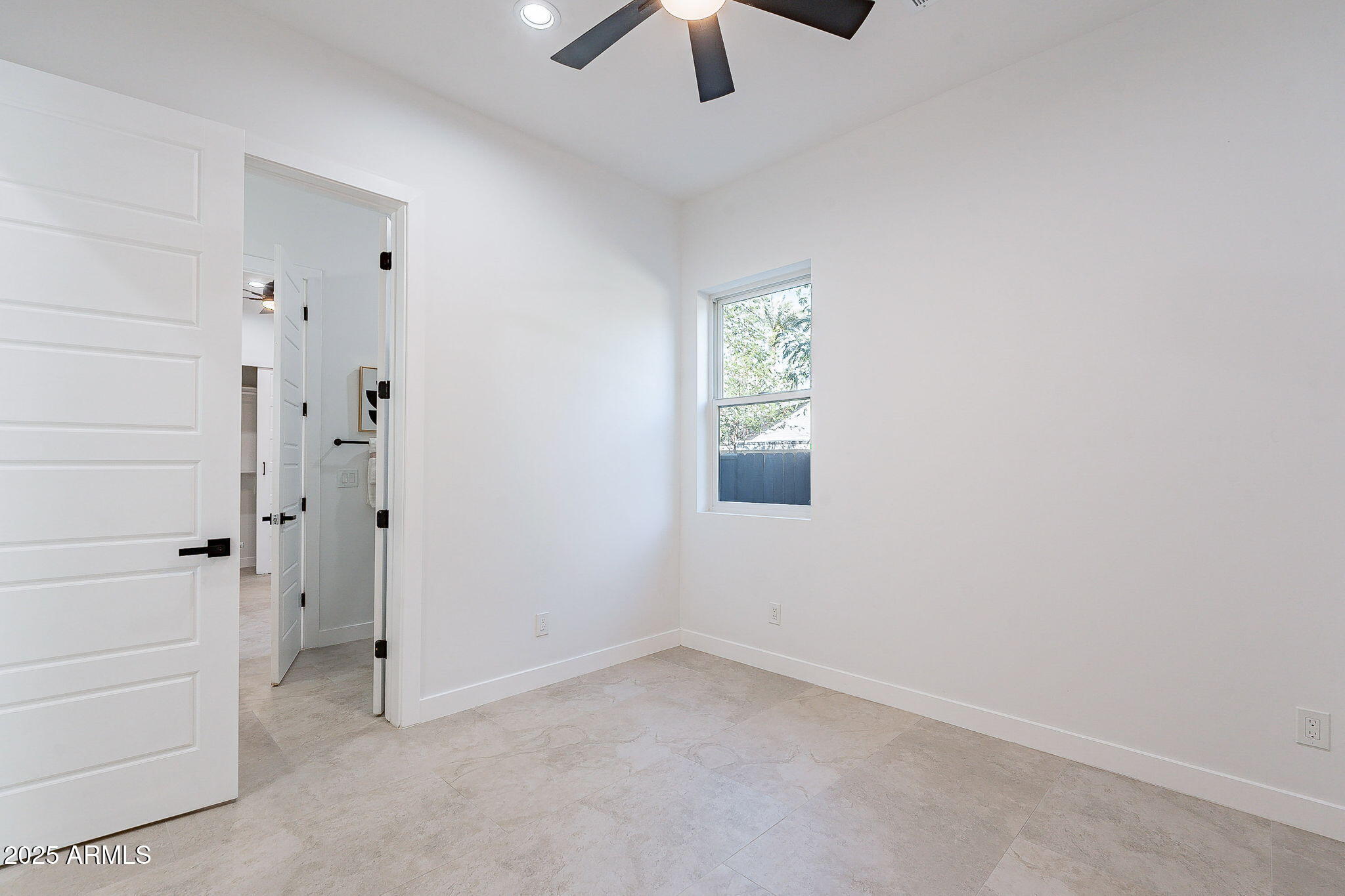 707 East Ocotillo Road Phoenix, AZ 85014 - Photo 40 of 59 wooden floor in an empty room with a window