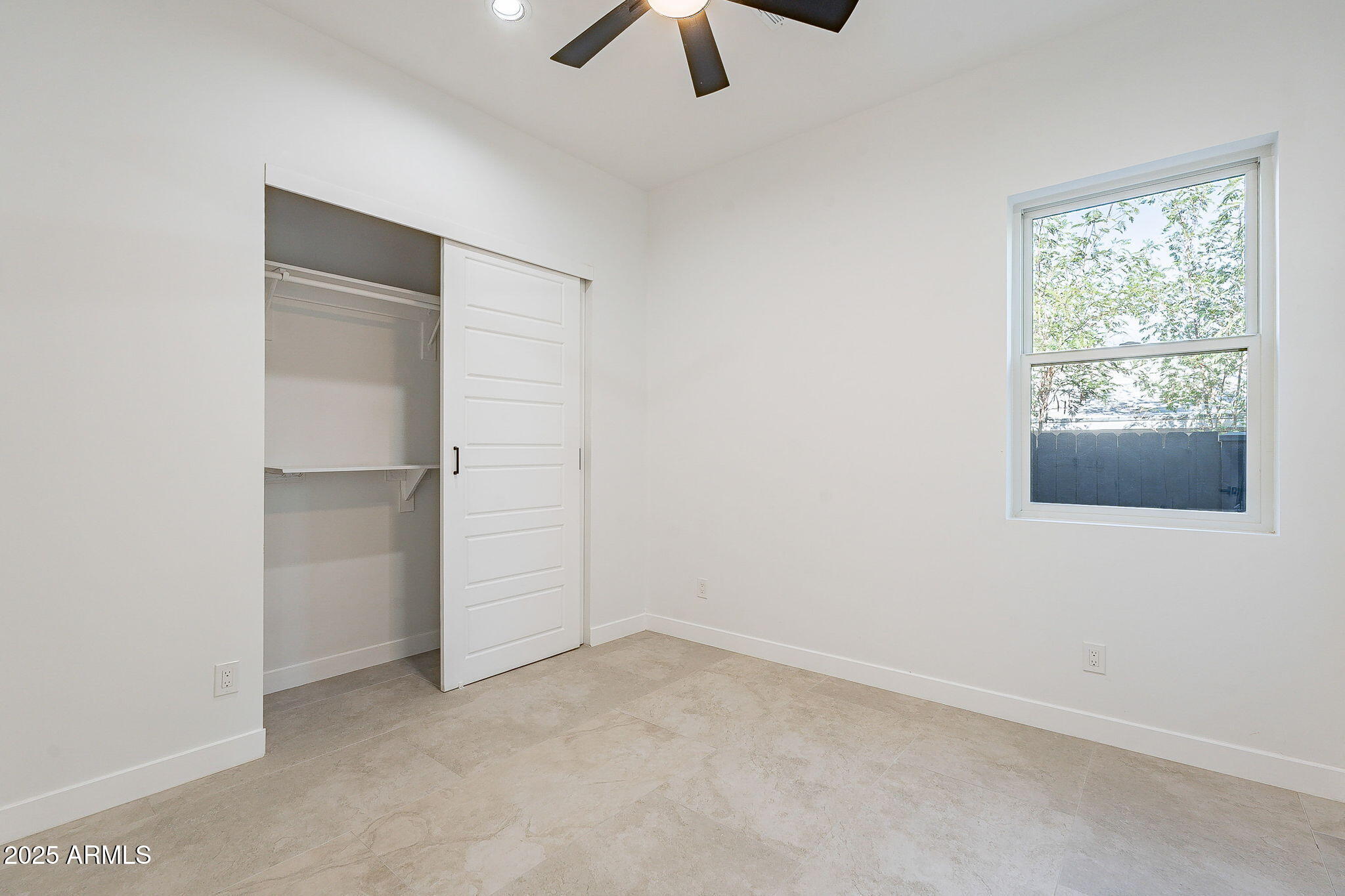 707 East Ocotillo Road Phoenix, AZ 85014 - Photo 43 of 59 an empty room with chandelier fan