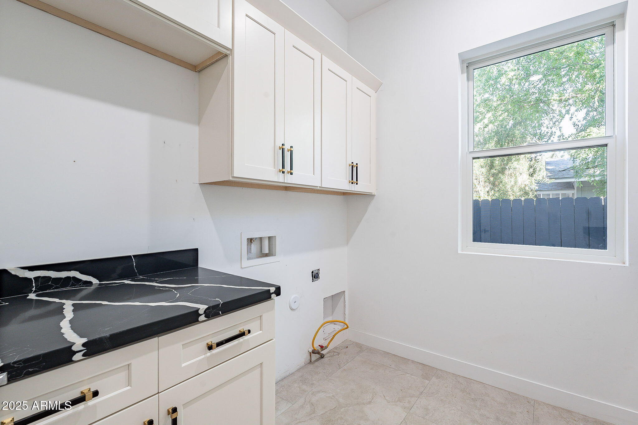 707 East Ocotillo Road Phoenix, AZ 85014 - Photo 47 of 59 a kitchen with granite countertop a stove and a sink