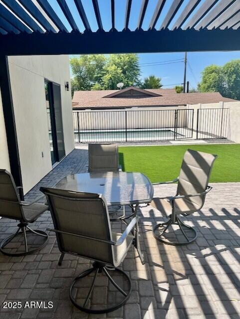 707 East Ocotillo Road Phoenix, AZ 85014 - Photo 6 of 59 a view of a patio with a table chairs and a barbeque