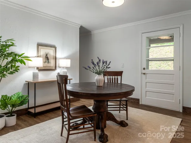 a dining room with furniture and window