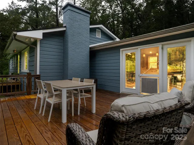 a balcony with furniture and wooden floor