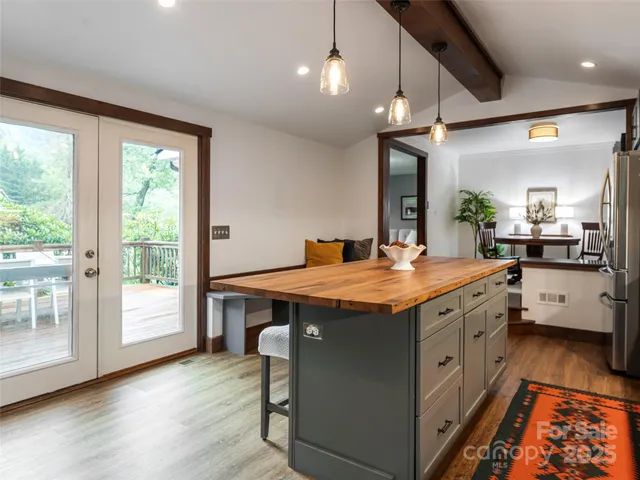 a spacious bathroom with a granite countertop sink and a large window