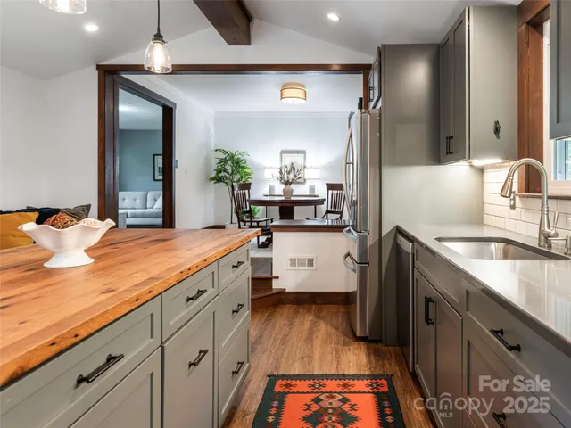 a kitchen with sink and cabinets