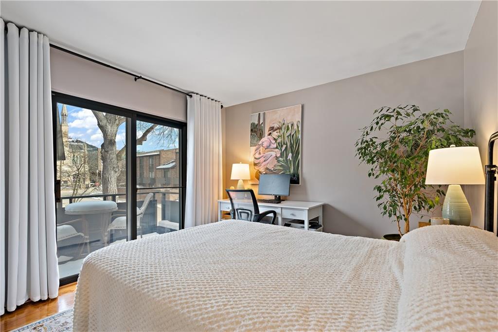 7 Foster Square Pittsburgh, PA 15212 - Photo 17 of 22 a bedroom with a large bed and a large window