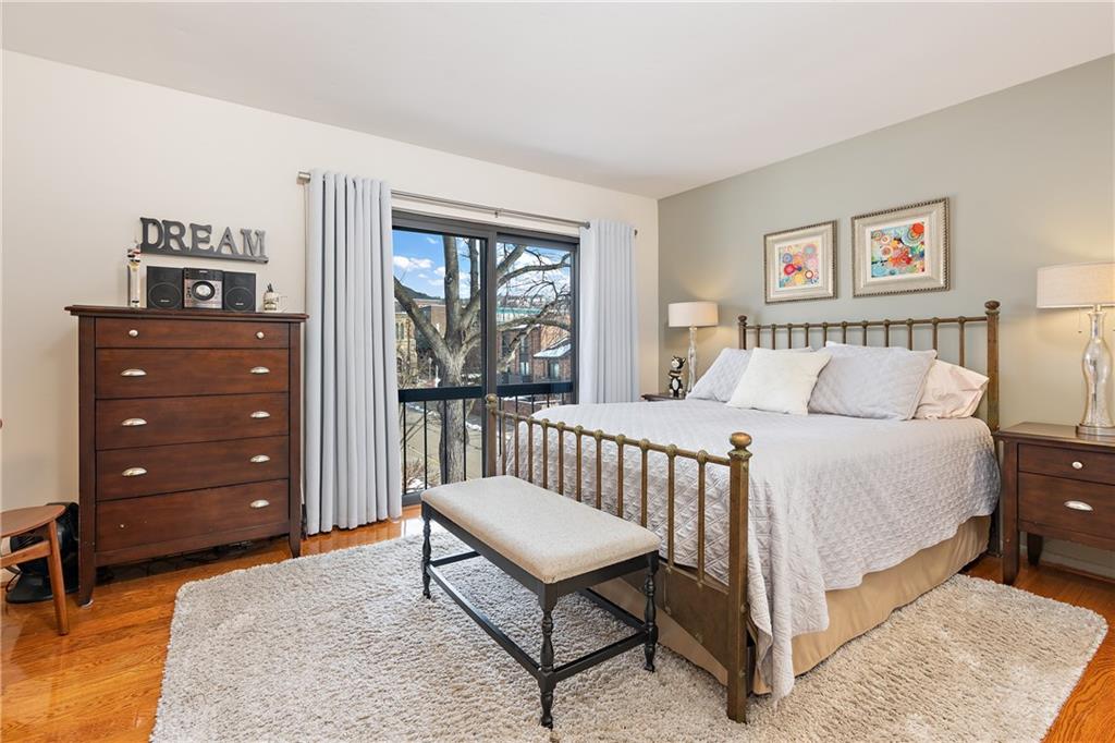 7 Foster Square Pittsburgh, PA 15212 - Photo 20 of 22 a bedroom with a bed a couch and a window