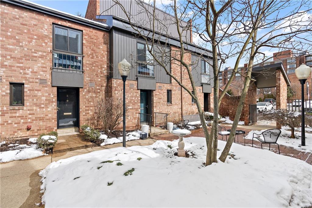 7 Foster Square Pittsburgh, PA 15212 - Photo 2 of 22 a view of a house with snow on the road