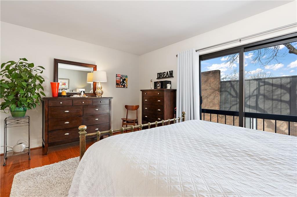 7 Foster Square Pittsburgh, PA 15212 - Photo 21 of 22 a bedroom with a bed and a large window