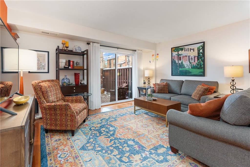 7 Foster Square Pittsburgh, PA 15212 - Photo 4 of 22 a living room with furniture and a rug