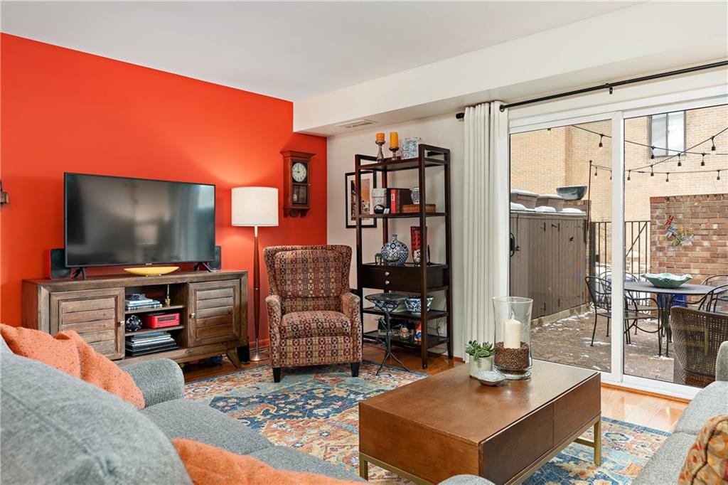 7 Foster Square Pittsburgh, PA 15212 - Photo 5 of 22 a living room with furniture and a flat screen tv