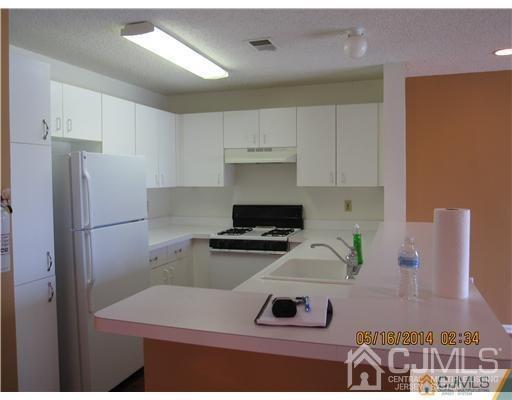 1023 Edpas Road New Brunswick, NJ 08901 - Photo 4 of 10 a kitchen with a refrigerator and a stove