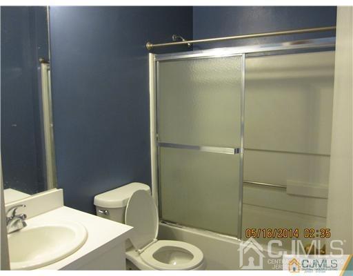 1023 Edpas Road New Brunswick, NJ 08901 - Photo 7 of 10 a bathroom with a sink and a mirror