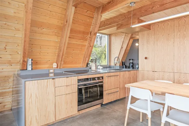 a kitchen with a stove a sink and a refrigerator