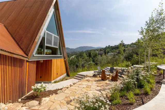 a view of backyard with patio