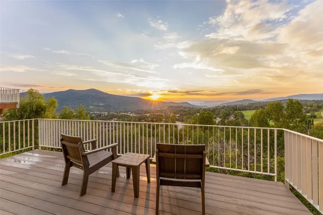 a view of a city and mountain from a balcony