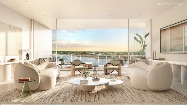 a living room with furniture large window and a table