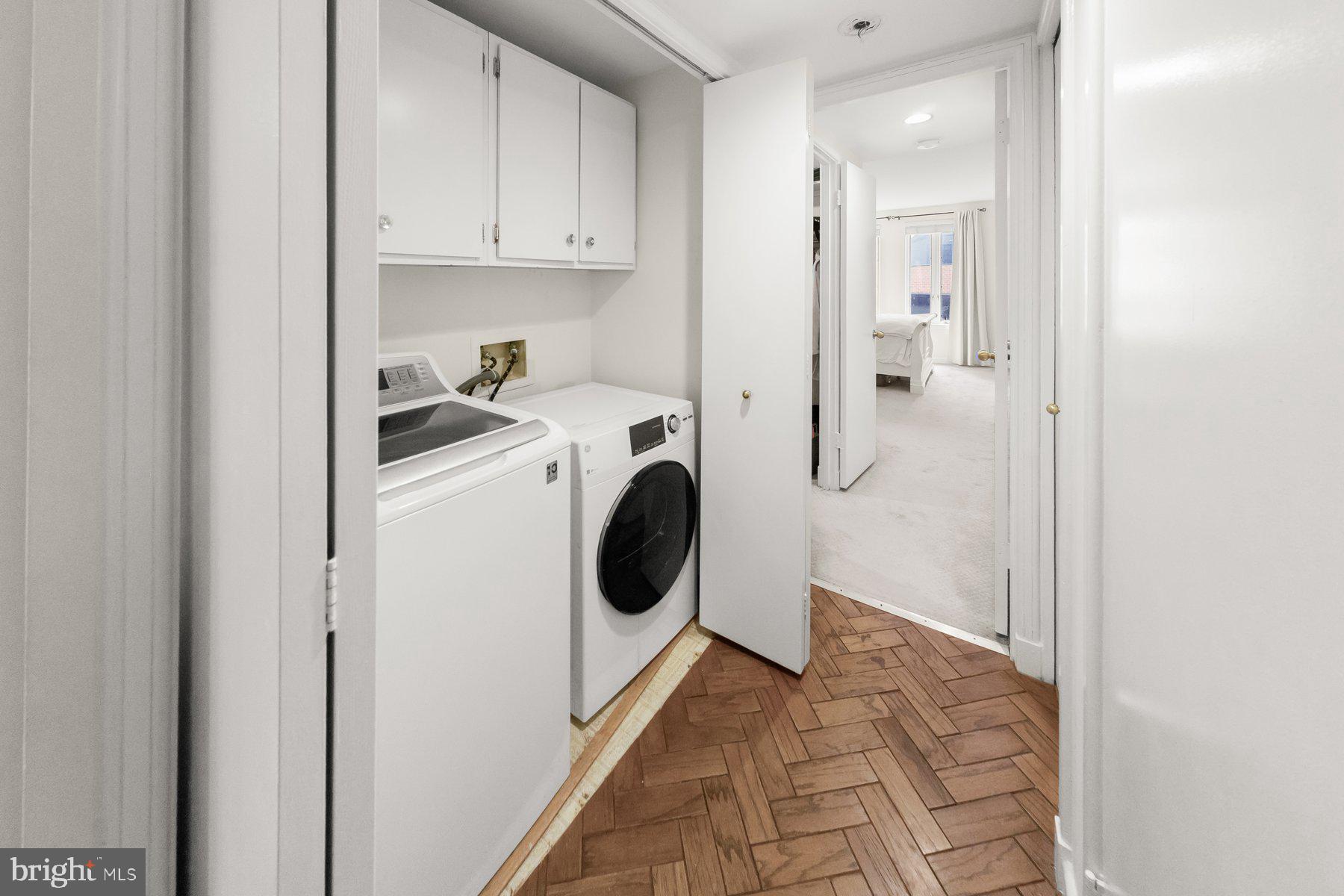 1045 31st Street Northwest, Unit 303 Washington, DC 20007 - Photo 11 of 12 a utility room with dryer and washer