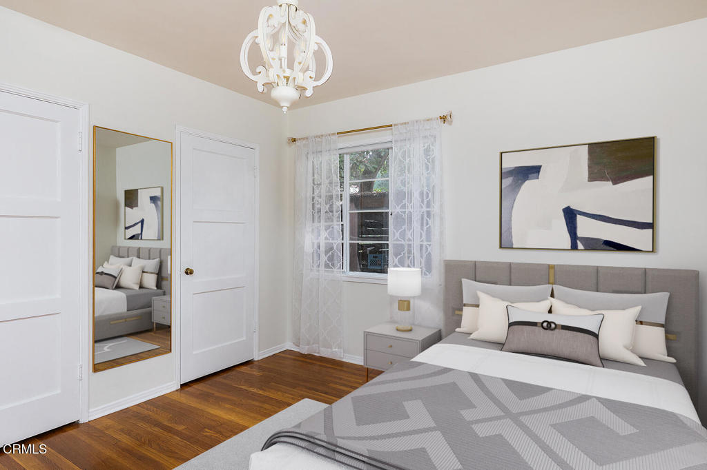 1070 East Woodbury Road Pasadena, CA 91104 - Photo 20 of 28 a bedroom with a large bed and a window