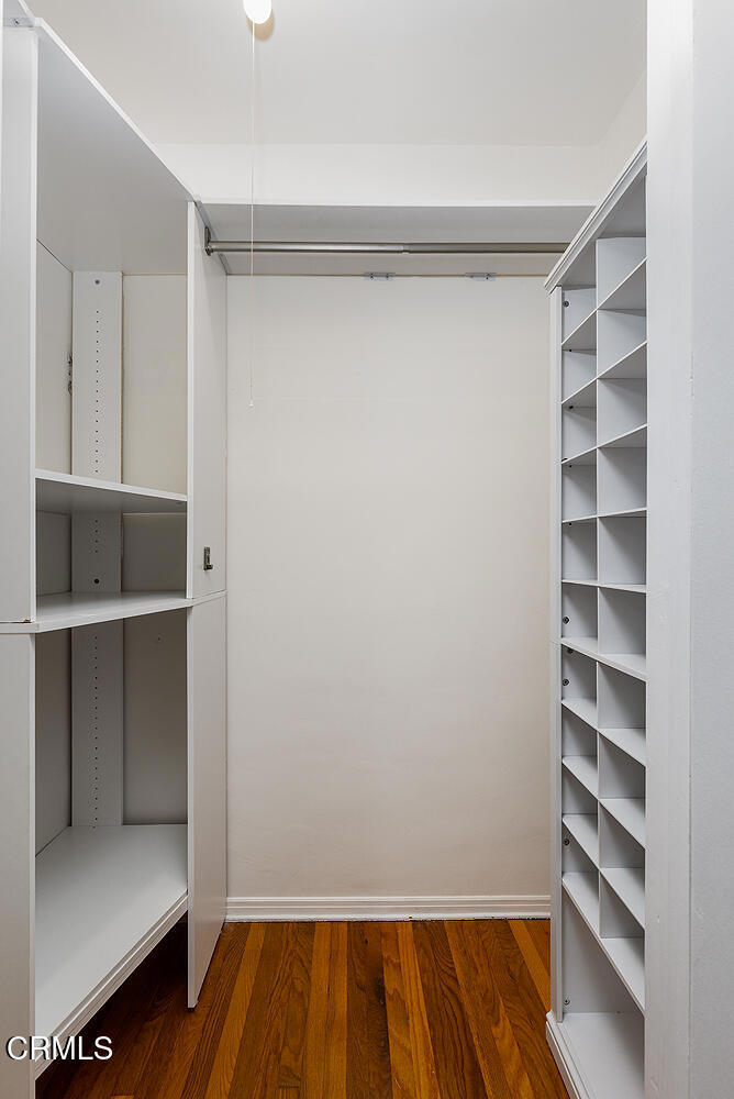 1070 East Woodbury Road Pasadena, CA 91104 - Photo 22 of 28 a view of walk in closet with empty racks