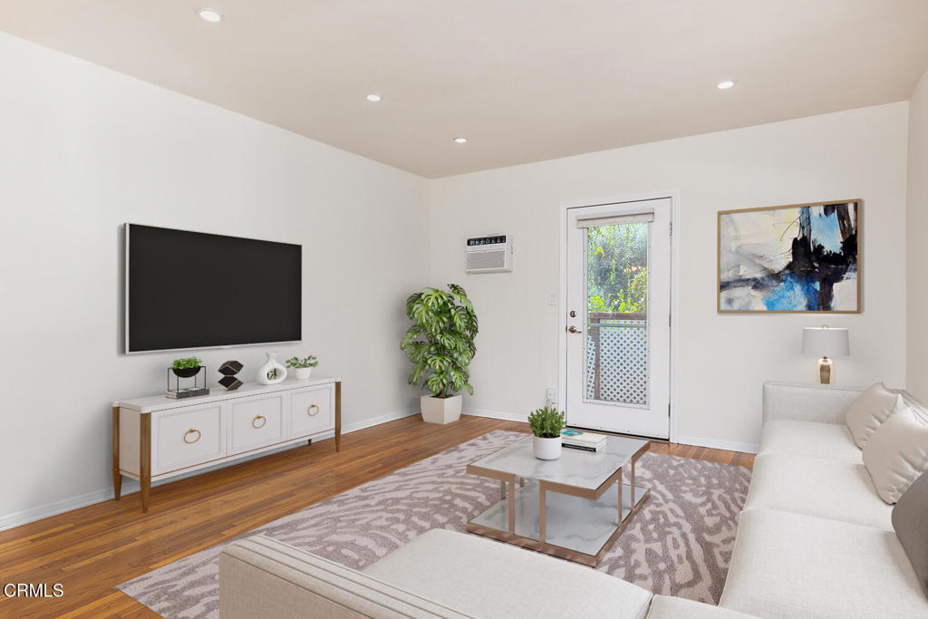 1070 East Woodbury Road Pasadena, CA 91104 - Photo 7 of 28 a living room with furniture and a flat screen tv