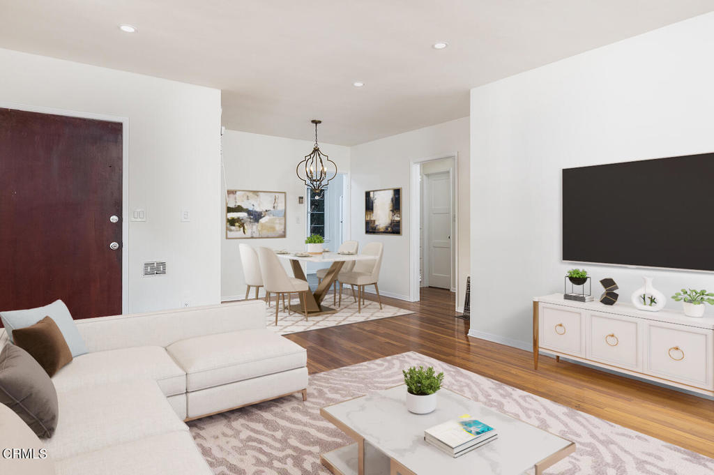 1070 East Woodbury Road Pasadena, CA 91104 - Photo 9 of 28 a living room with furniture and a flat screen tv