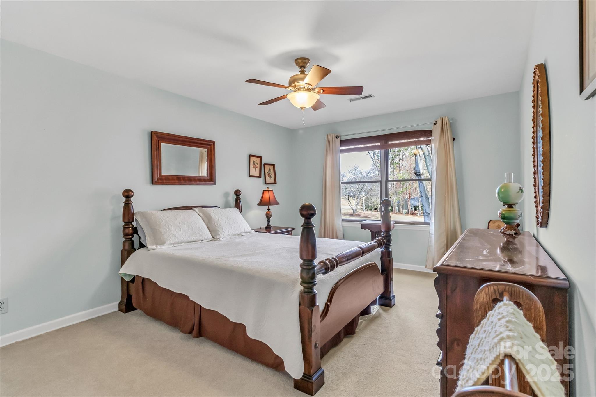 3 Lake Ridge Road Clover, SC 29710 - Photo 33 of 41 a bed room with a bed and a chandelier