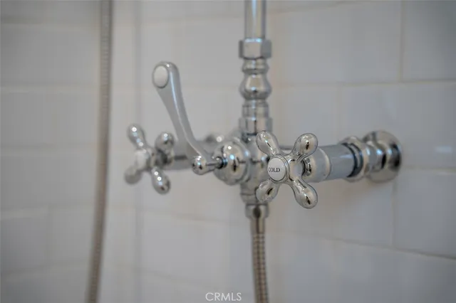 a kitchen with stainless steel appliances a stove refrigerator sink and microwave