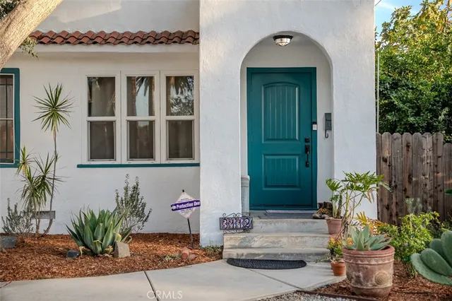 a kitchen with kitchen island stainless steel appliances a stove a sink a refrigerator and cabinets