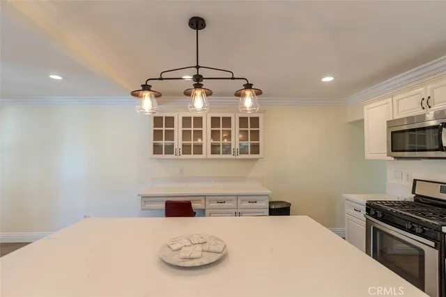 a view of entryway with window and wooden floor