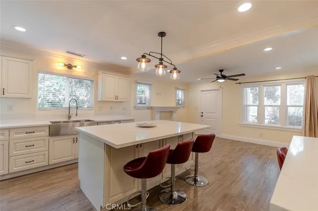 a view of a livingroom with an empty space wooden floor and window