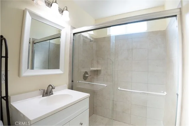 a kitchen with kitchen island a sink appliances and cabinets