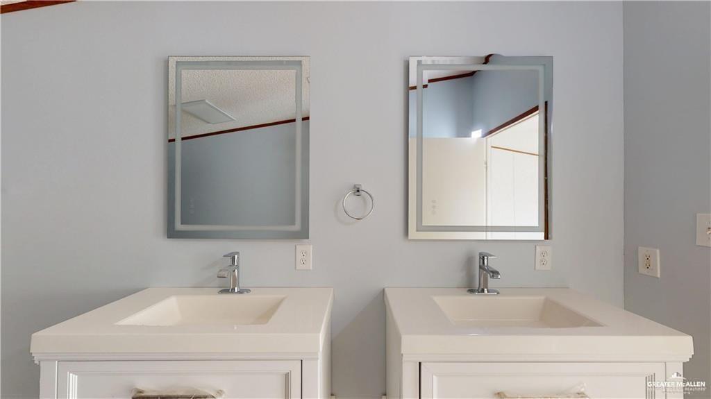 613 East Loop 19th Street Weslaco, TX 78596 - Photo 12 of 30 a bathroom with a sink and a mirror