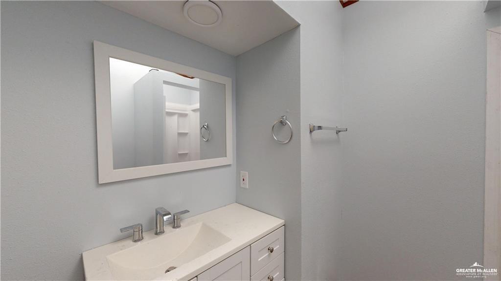 613 East Loop 19th Street Weslaco, TX 78596 - Photo 22 of 30 a bathroom with a sink and mirror