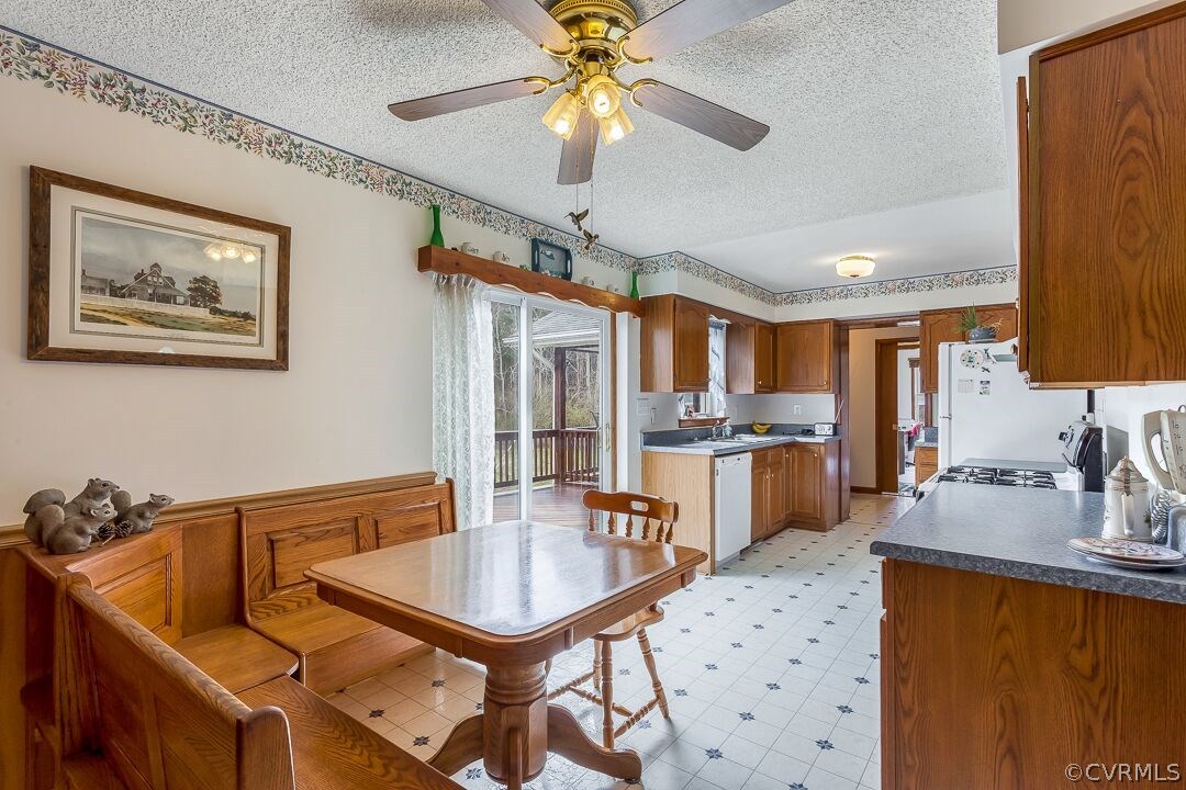 8338 Marye Road Partlow, VA 22534 - Photo 11 of 32 a kitchen with a table chairs sink and cabinets