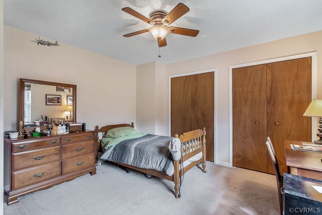 8338 Marye Road Partlow, VA 22534 - Photo 20 of 32 a bedroom with a bed and a table in it