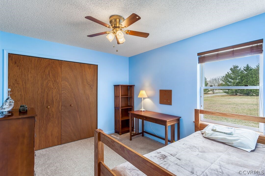 8338 Marye Road Partlow, VA 22534 - Photo 22 of 32 a bedroom with a bed and a large window